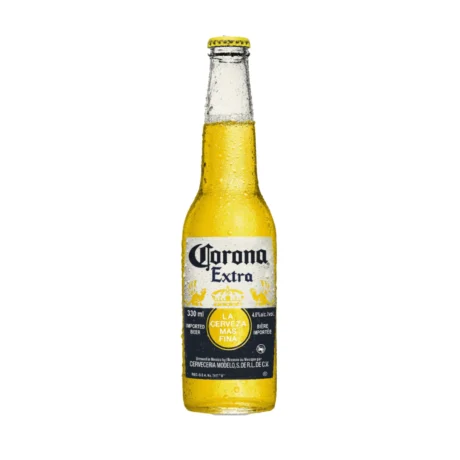 A clear glass bottle of Corona Extra Mexican Lager with a lime wedge in the neck, showcasing its golden color, available for fast delivery in Amman, Jordan.