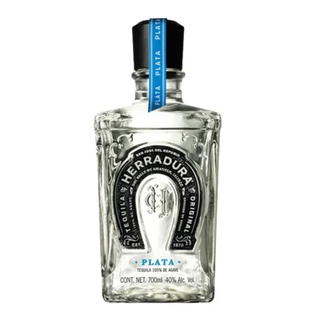 The iconic square bottle of Herradura Plata Tequila with its silver horseshoe logo, a premium 100% agave spirit available for delivery in Amman.
