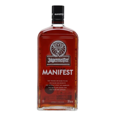 The clear glass bottle of Jägermeister Manifest showing its dark copper spirit and bronze plaque, a super-premium 38% ABV herbal liqueur available for delivery in Amman.