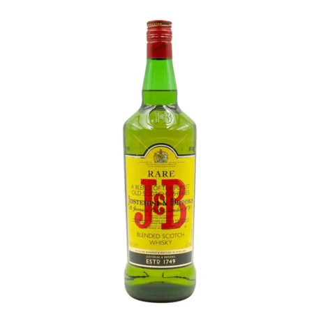 The iconic yellow label and green bottle of J&B Rare Blended Scotch Whisky, featuring its classic 1749 heritage branding, available for delivery in Amman, Jordan.